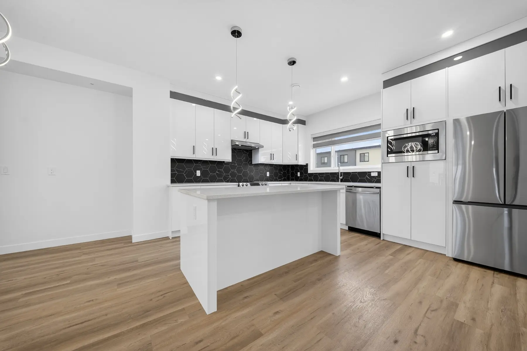 Bright contemporary kitchen inside a home at The Palms at Salisbury