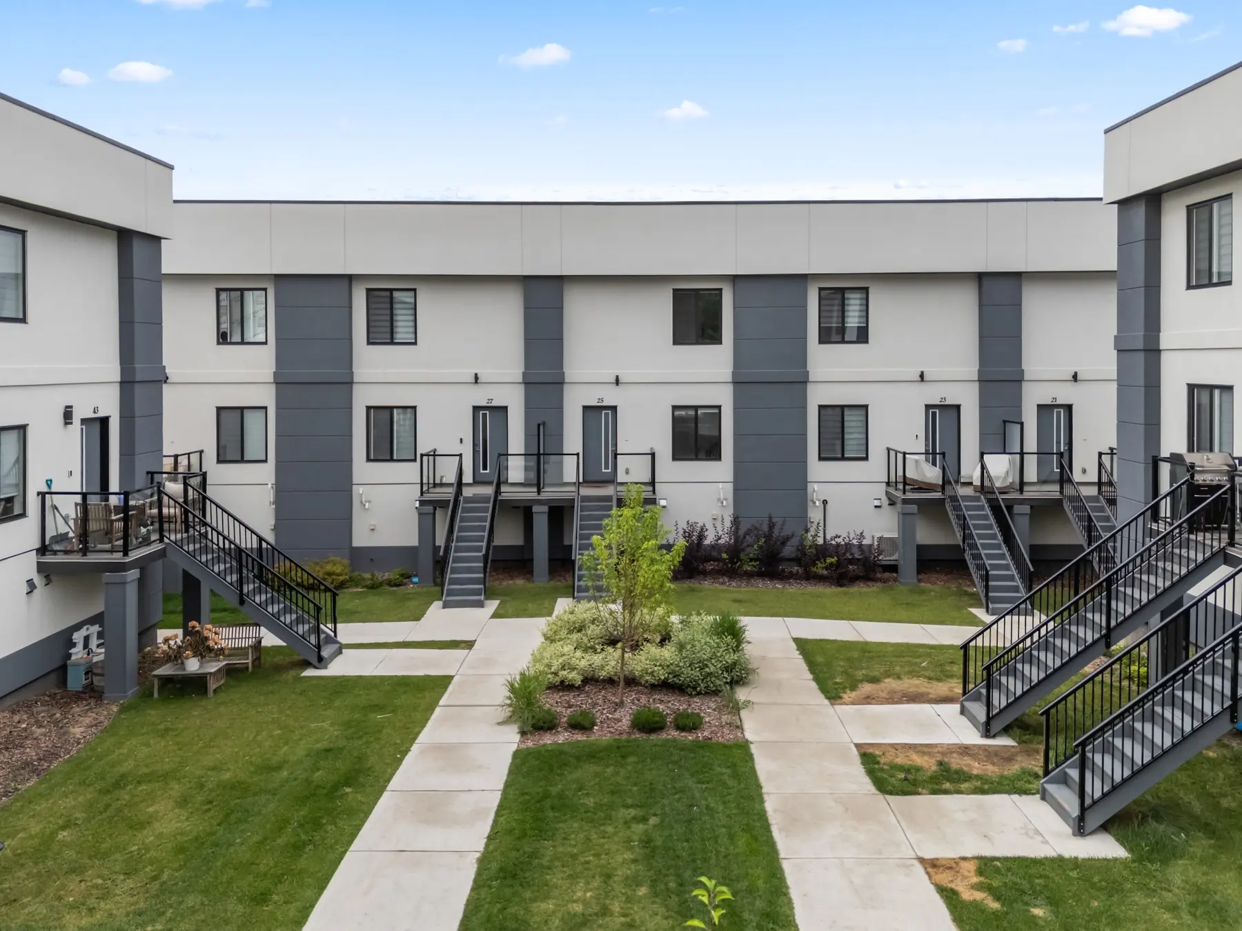 Landscaped courtyard and townhouse exteriors at The Palms at Salisbury